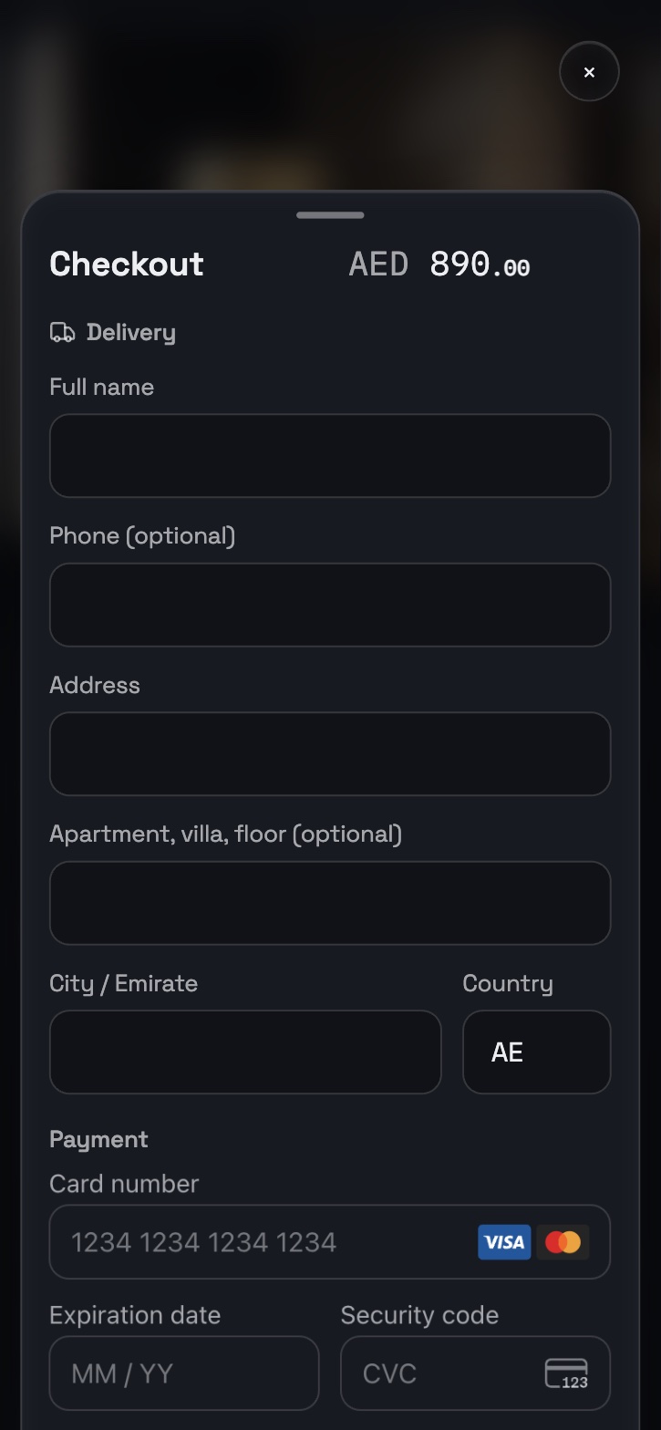 Checkout sheet: AED 890 total, delivery address fields and the Stripe card form